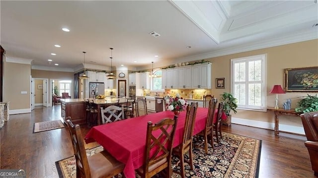 dining space with crown molding and dark hardwood / wood-style floors