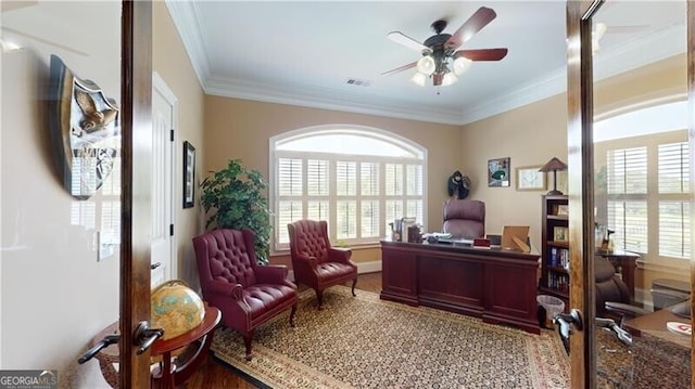 office space with a wealth of natural light, ceiling fan, hardwood / wood-style flooring, and ornamental molding