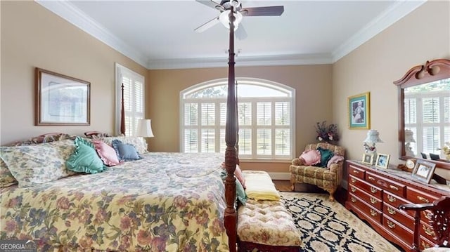 bedroom featuring ceiling fan and crown molding