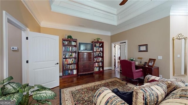 living room featuring ceiling fan, dark hardwood / wood-style floors, and ornamental molding