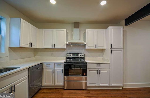 kitchen featuring dishwasher, white cabinetry, and wall chimney exhaust hood