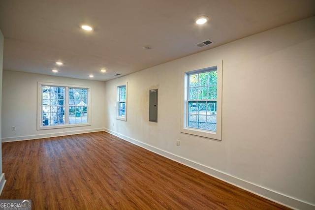 unfurnished room with hardwood / wood-style floors