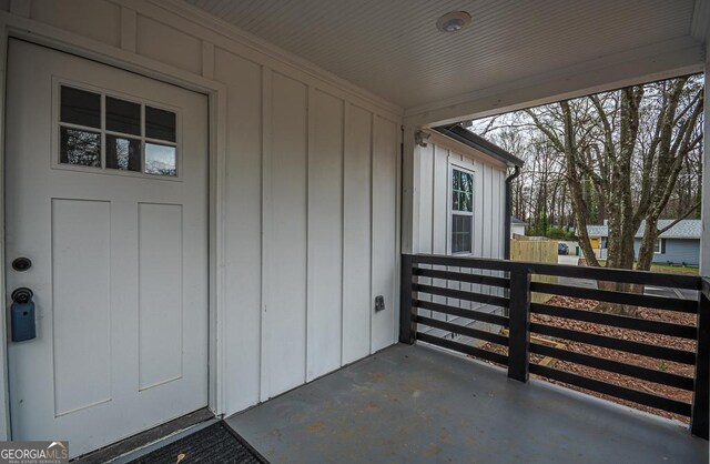 entryway with dark wood-type flooring and a wealth of natural light