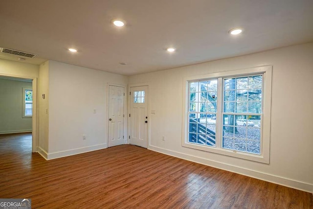 foyer entrance with dark hardwood / wood-style floors