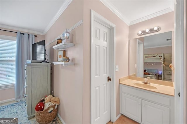 bathroom with baseboards, ornamental molding, connected bathroom, and vanity