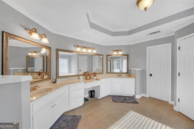 bathroom with tile patterned flooring, vanity, and ornamental molding