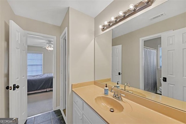 bathroom with toilet, tile patterned floors, vanity, visible vents, and a shower with curtain