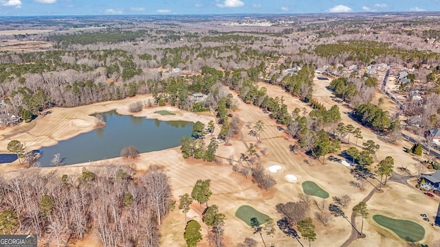 birds eye view of property featuring a wooded view