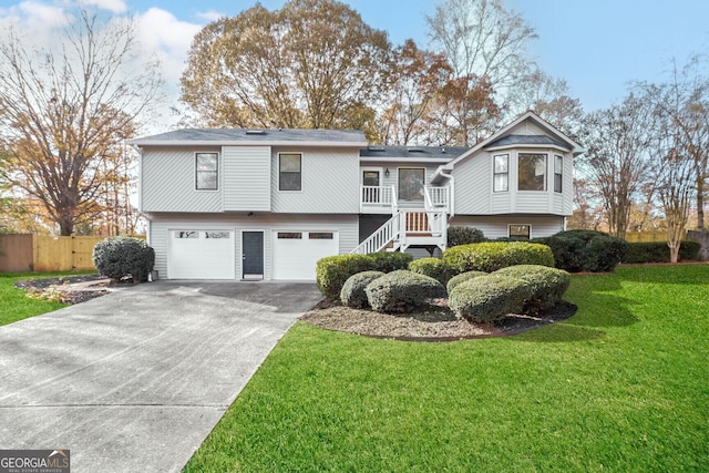 bi-level home featuring a front yard and a garage