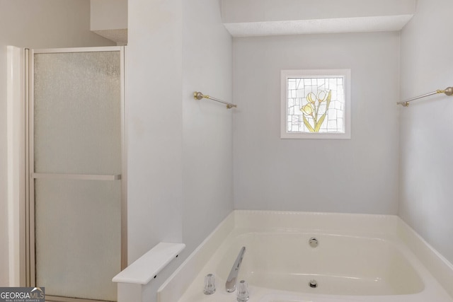 bathroom featuring plus walk in shower