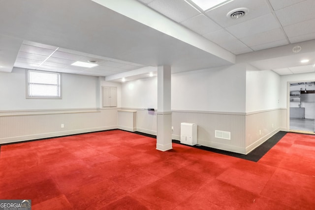 basement featuring a drop ceiling