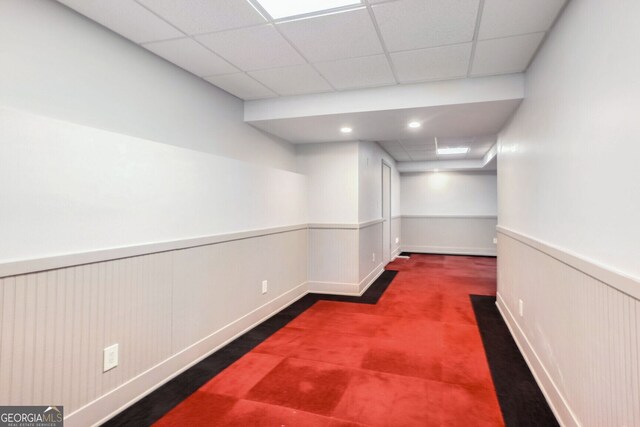 basement featuring a drop ceiling