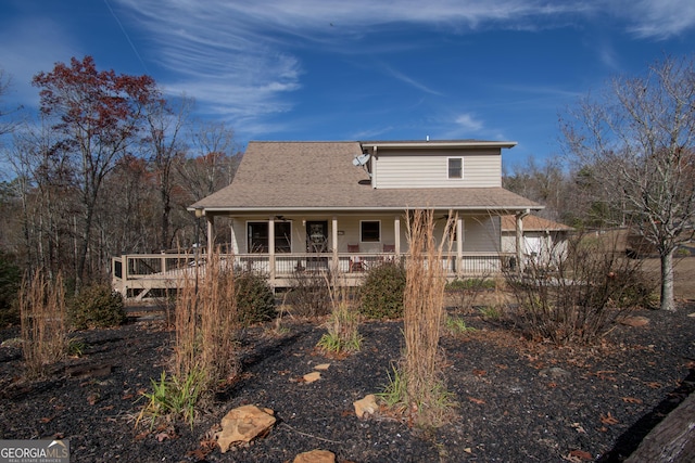 back of house featuring a porch