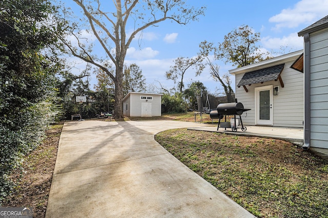 view of yard featuring a storage shed, a patio, and a trampoline