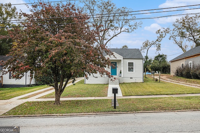 view of front of home with a front lawn