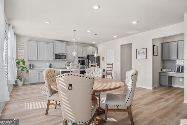 dining room featuring light hardwood / wood-style flooring