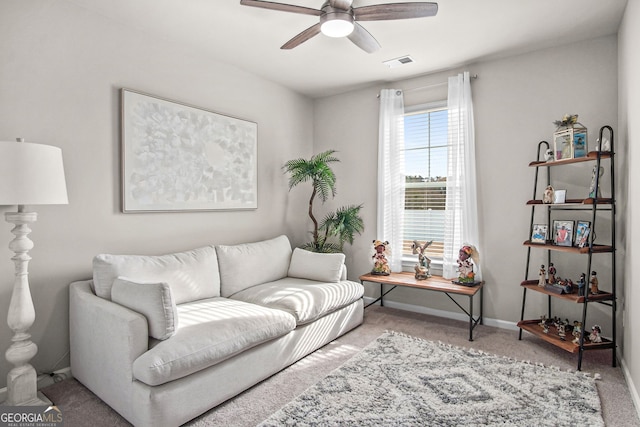 living room with carpet and ceiling fan