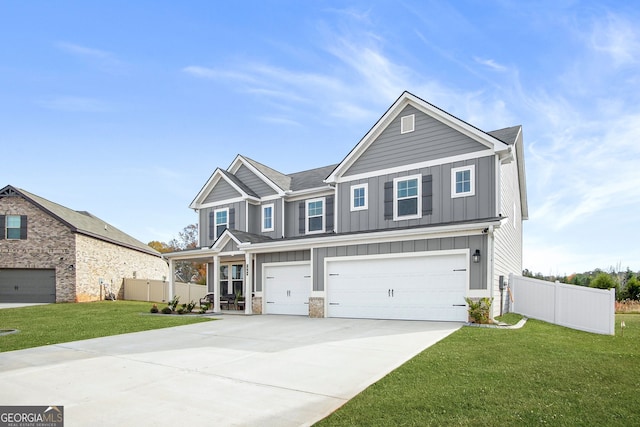 view of front of house with a front lawn and a garage