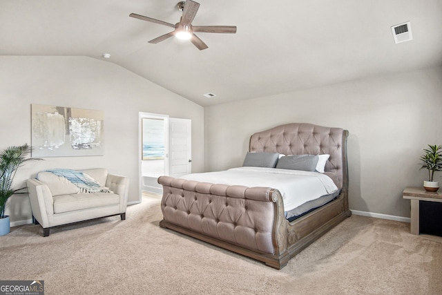 bedroom featuring ceiling fan, lofted ceiling, and light carpet