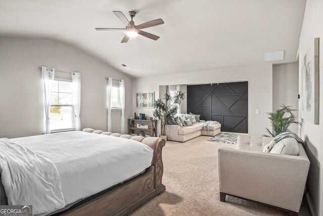 carpeted bedroom featuring ceiling fan and lofted ceiling