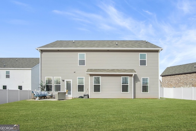 back of house with a lawn and outdoor lounge area