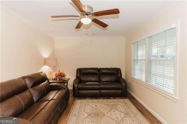 living room with ceiling fan, wood-type flooring, and ornamental molding