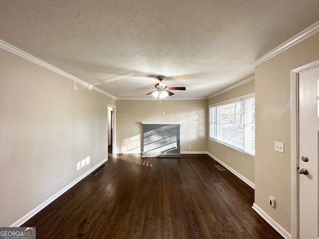 unfurnished living room with ceiling fan, ornamental molding, and dark wood-type flooring