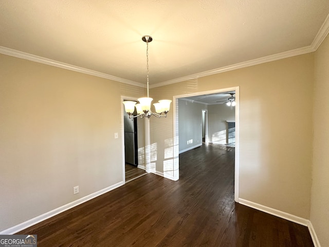 unfurnished dining area with ceiling fan with notable chandelier, dark hardwood / wood-style flooring, and ornamental molding