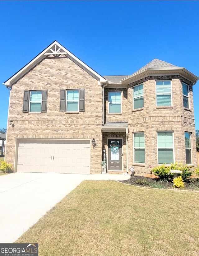 view of front of property with brick siding, a front lawn, roof with shingles, a garage, and driveway