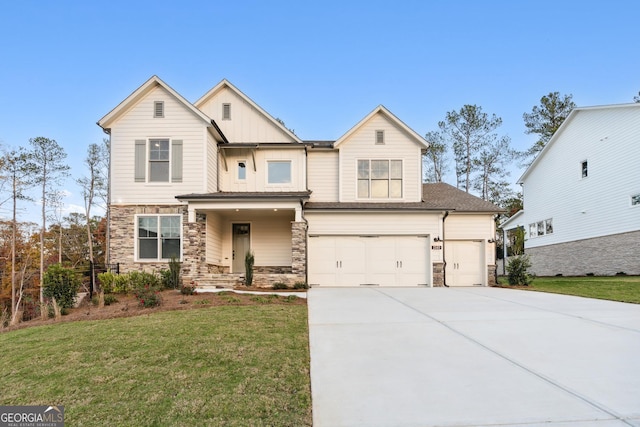 view of front of property with a garage and a front yard