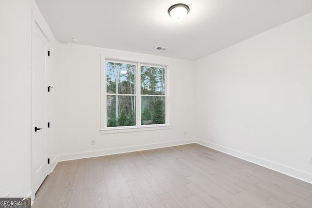 spare room featuring light wood-type flooring