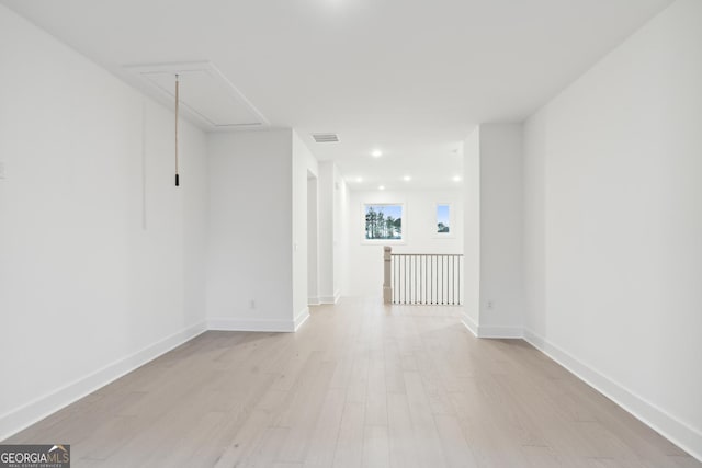 unfurnished room with light wood-type flooring