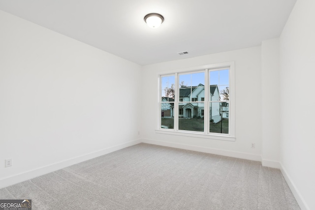 unfurnished room featuring carpet