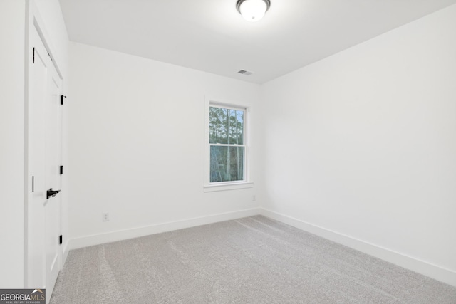 unfurnished room with carpet flooring