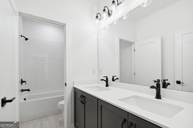 full bathroom featuring vanity, toilet, and bathing tub / shower combination