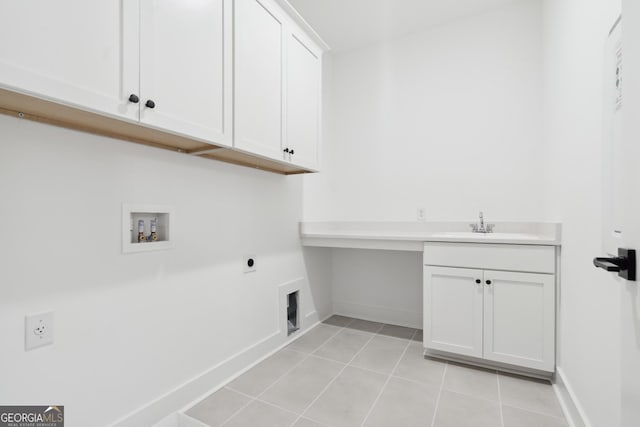 laundry area with cabinets, sink, washer hookup, hookup for an electric dryer, and light tile patterned flooring