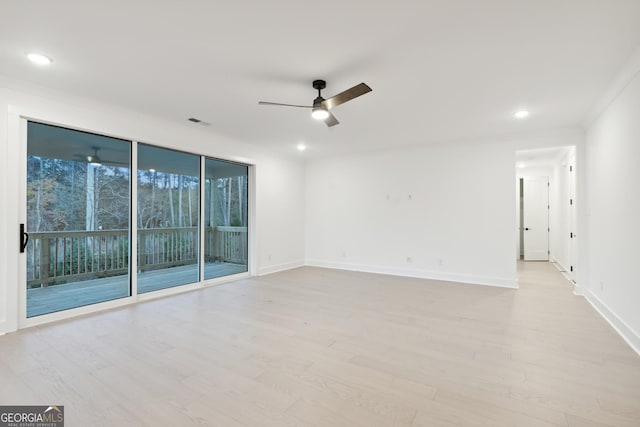 unfurnished room with light wood-type flooring, ceiling fan, and ornamental molding