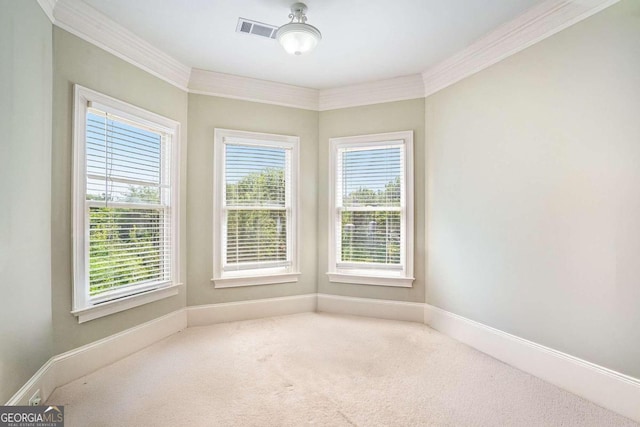 carpeted empty room with ornamental molding