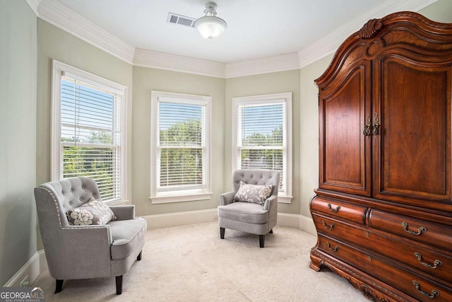 living area featuring light carpet and ornamental molding