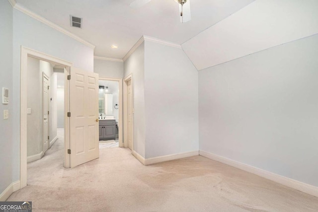 additional living space featuring light colored carpet, ceiling fan, and sink