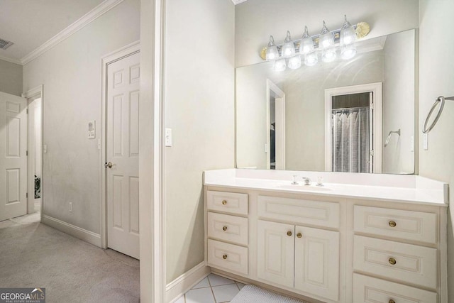 bathroom with tile patterned flooring, vanity, crown molding, and walk in shower