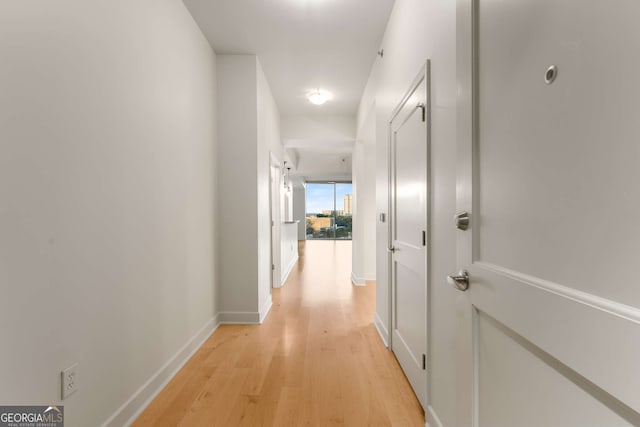 corridor featuring light wood-type flooring