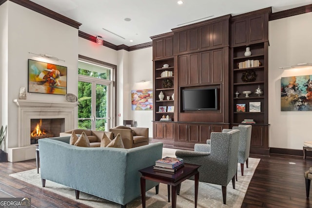 living room with dark hardwood / wood-style flooring, a fireplace, and ornamental molding