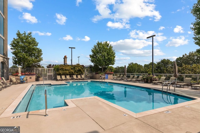 view of pool featuring a patio