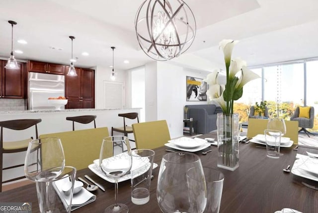 dining room featuring dark hardwood / wood-style flooring and a chandelier