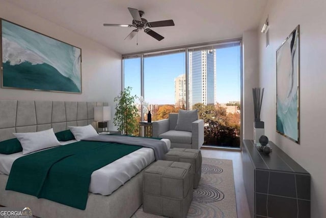 bedroom with ceiling fan and a wall of windows