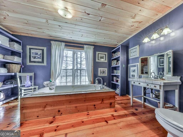 home office with wood-type flooring, sink, and wood ceiling