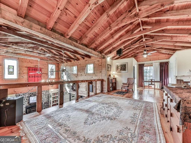 miscellaneous room featuring a fireplace, a wealth of natural light, ceiling fan, and wooden ceiling