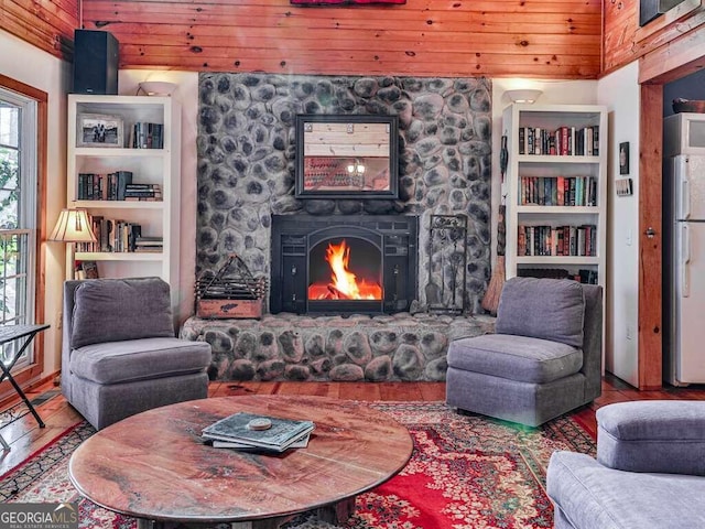 living room with built in features, wood-type flooring, and wooden ceiling