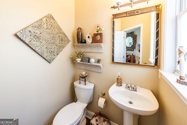 bathroom with toilet and sink